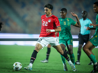 Omar Marmoush of Egypt battles for possession with Mouhsine Bodda of Mauritania during Africa Cup of Nations Qualifiers 2025 match number 61...