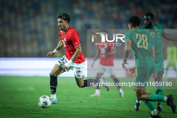 Omar Marmoush of Egypt battles for possession with Mouhsine Bodda of Mauritania during Africa Cup of Nations Qualifiers 2025 match number 61...