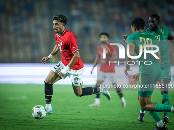 Omar Marmoush of Egypt battles for possession with Mouhsine Bodda of Mauritania during Africa Cup of Nations Qualifiers 2025 match number 61...