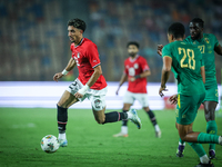 Omar Marmoush of Egypt battles for possession with Mouhsine Bodda of Mauritania during Africa Cup of Nations Qualifiers 2025 match number 61...