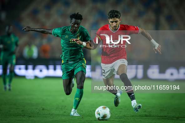 Omar Marmoush of Egypt battles for possession with Idrissa Thiam of Mauritania during Africa Cup of Nations Qualifiers 2025 match number 61...