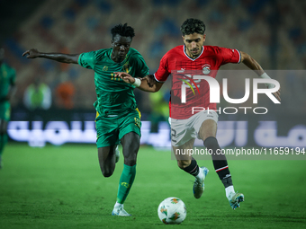 Omar Marmoush of Egypt battles for possession with Idrissa Thiam of Mauritania during Africa Cup of Nations Qualifiers 2025 match number 61...