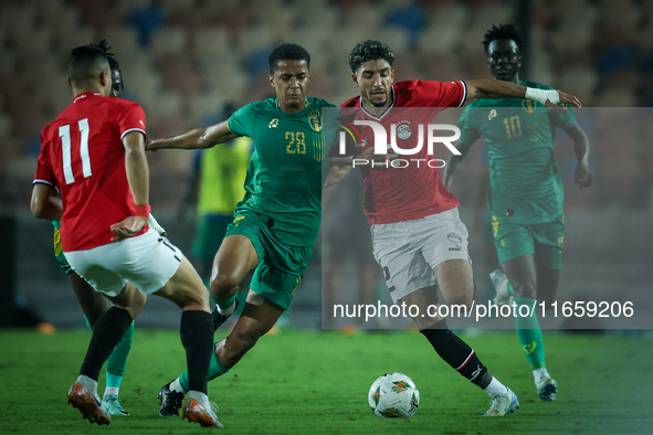 Omar Marmoush of Egypt battles for possession with Oumar Jacky Ngom of Mauritania during the Africa Cup of Nations Qualifiers 2025, match nu...