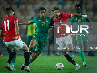 Omar Marmoush of Egypt battles for possession with Oumar Jacky Ngom of Mauritania during the Africa Cup of Nations Qualifiers 2025, match nu...