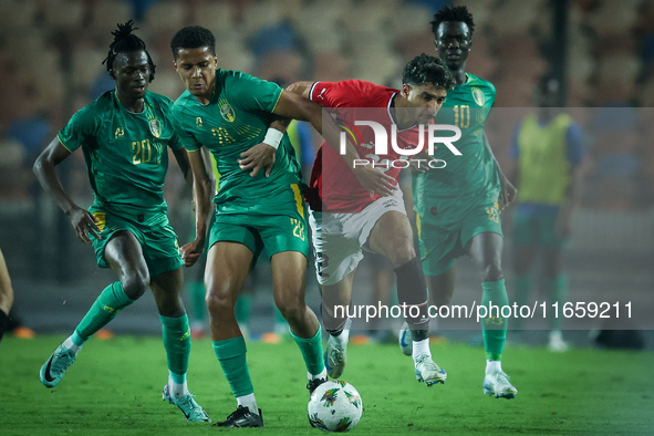 Omar Marmoush of Egypt battles for possession with Oumar Jacky Ngom of Mauritania during the Africa Cup of Nations Qualifiers 2025, match nu...