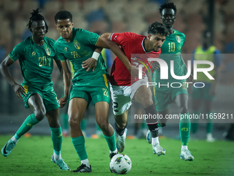 Omar Marmoush of Egypt battles for possession with Oumar Jacky Ngom of Mauritania during the Africa Cup of Nations Qualifiers 2025, match nu...