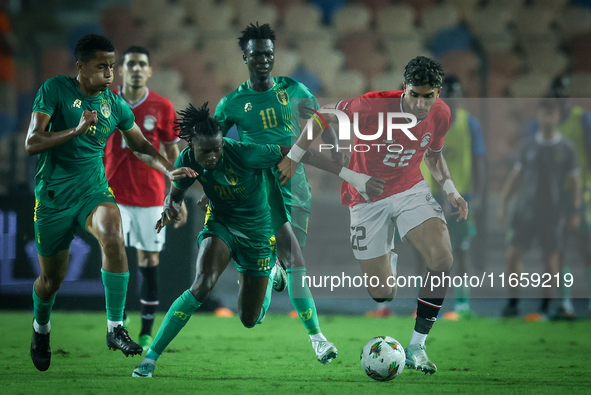 Omar Marmoush of Egypt battles for possession with Keita Ibrahima of Mauritania during Africa Cup of Nations Qualifiers 2025 match number 61...