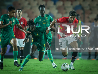 Omar Marmoush of Egypt battles for possession with Keita Ibrahima of Mauritania during Africa Cup of Nations Qualifiers 2025 match number 61...