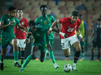 Omar Marmoush of Egypt battles for possession with Keita Ibrahima of Mauritania during Africa Cup of Nations Qualifiers 2025 match number 61...