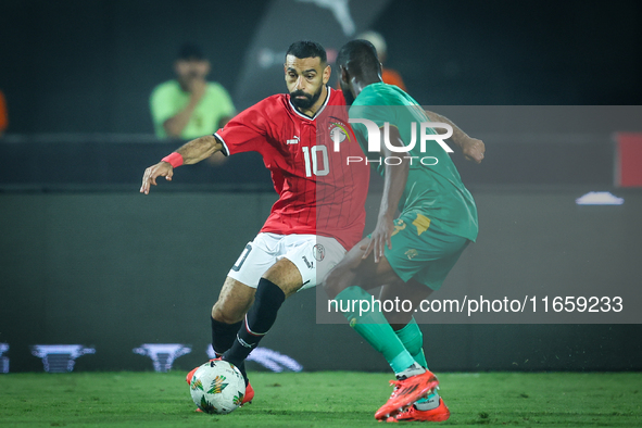 Mohamed Salah of Egypt battles for possession with Abeid Aly of Mauritania during the Africa Cup of Nations Qualifiers 2025 match number 61...