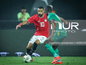 Mohamed Salah of Egypt battles for possession with Abeid Aly of Mauritania during the Africa Cup of Nations Qualifiers 2025 match number 61...