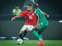 Mohamed Salah of Egypt battles for possession with Abeid Aly of Mauritania during the Africa Cup of Nations Qualifiers 2025 match number 61...