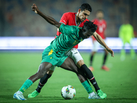 Mohamed Hamdy of Egypt battles for possession with Idrissa Thiam of Mauritania during Africa Cup of Nations Qualifiers 2025 match number 61...