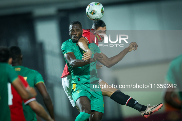 Ramy Rabiaa of Egypt battles for possession with El Hassen Houeibib of Mauritania during Africa Cup of Nations Qualifiers 2025 match number...