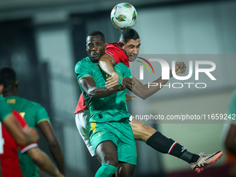 Ramy Rabiaa of Egypt battles for possession with El Hassen Houeibib of Mauritania during Africa Cup of Nations Qualifiers 2025 match number...