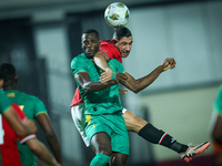 Ramy Rabiaa of Egypt battles for possession with El Hassen Houeibib of Mauritania during Africa Cup of Nations Qualifiers 2025 match number...