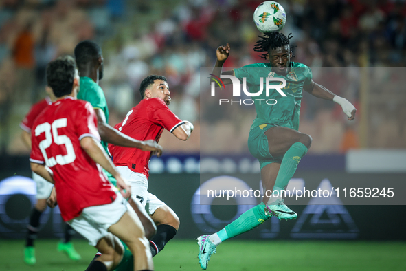 Mahmoud Ahmed of Egypt battles for possession with Keita Ibrahima of Mauritania during the Africa Cup of Nations Qualifiers 2025 match numbe...