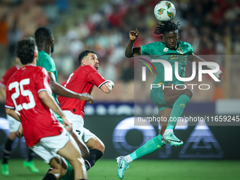 Mahmoud Ahmed of Egypt battles for possession with Keita Ibrahima of Mauritania during the Africa Cup of Nations Qualifiers 2025 match numbe...