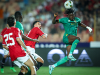 Mahmoud Ahmed of Egypt battles for possession with Keita Ibrahima of Mauritania during the Africa Cup of Nations Qualifiers 2025 match numbe...