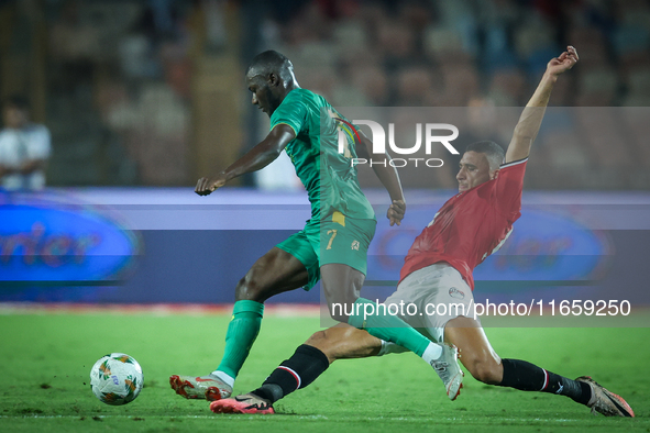 Ramy Rabiaa of Egypt battles for possession with Aboubakary Koita of Mauritania during the Africa Cup of Nations qualifiers 2025 match numbe...