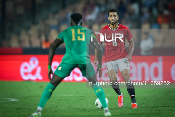 Mohamed Abdelmoneim of Egypt battles for possession with Papa Ndiaga Yade of Mauritania during the Africa Cup of Nations Qualifiers 2025, ma...