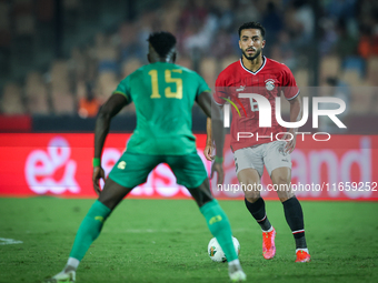 Mohamed Abdelmoneim of Egypt battles for possession with Papa Ndiaga Yade of Mauritania during the Africa Cup of Nations Qualifiers 2025, ma...