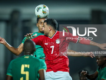 Mahmoud Ahmed of Egypt battles for possession with Oumar Jacky Ngom of Mauritania during the Africa Cup of Nations qualifiers 2025, match nu...