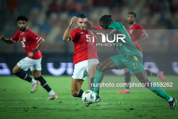 Ramy Rabiaa of Egypt battles for possession with Aboubakar Kamara of Mauritania during the Africa Cup of Nations Qualifiers 2025, match numb...