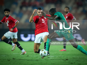 Ramy Rabiaa of Egypt battles for possession with Aboubakar Kamara of Mauritania during the Africa Cup of Nations Qualifiers 2025, match numb...