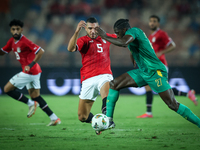 Ramy Rabiaa of Egypt battles for possession with Aboubakar Kamara of Mauritania during the Africa Cup of Nations Qualifiers 2025, match numb...