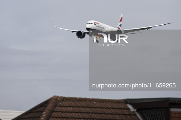 British Airways Boeing 787-8 Dreamliner aircraft spotted flying on final approach over the roofs of the houses of Myrtle avenue for landing...