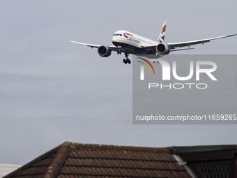 British Airways Boeing 787-8 Dreamliner aircraft spotted flying on final approach over the roofs of the houses of Myrtle avenue for landing...