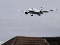 British Airways Boeing 787-8 Dreamliner aircraft spotted flying on final approach over the roofs of the houses of Myrtle avenue for landing...