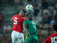 Ramy Rabiaa of Egypt battles for possession with Aboubakar Kamara of Mauritania during the Africa Cup of Nations Qualifiers 2025, match numb...