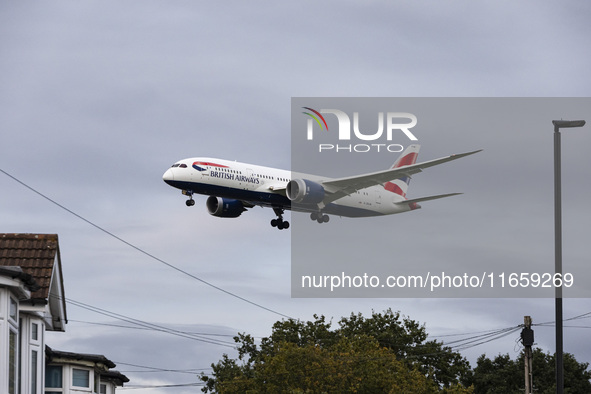 British Airways Boeing 787-8 Dreamliner aircraft spotted flying on final approach over the roofs of the houses of Myrtle avenue for landing...