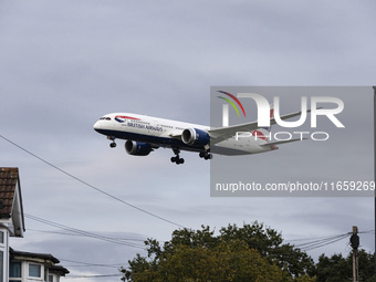 British Airways Boeing 787-8 Dreamliner aircraft spotted flying on final approach over the roofs of the houses of Myrtle avenue for landing...