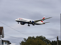 British Airways Boeing 787-8 Dreamliner aircraft spotted flying on final approach over the roofs of the houses of Myrtle avenue for landing...