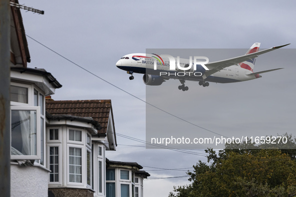 British Airways Boeing 787-8 Dreamliner aircraft spotted flying on final approach over the roofs of the houses of Myrtle avenue for landing...