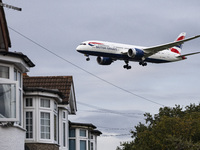 British Airways Boeing 787-8 Dreamliner aircraft spotted flying on final approach over the roofs of the houses of Myrtle avenue for landing...