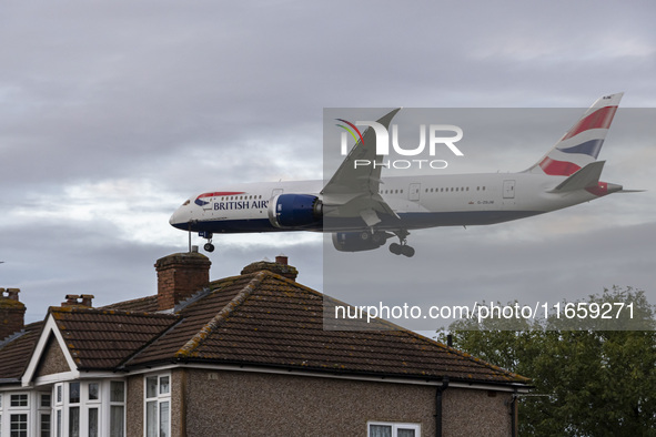 British Airways Boeing 787-8 Dreamliner aircraft spotted flying on final approach over the roofs of the houses of Myrtle avenue for landing...