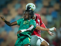 Mahmoud Ahmed of Egypt battles for possession with Keita Ibrahima of Mauritania during the Africa Cup of Nations Qualifiers 2025 match numbe...