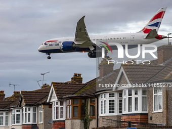 British Airways Boeing 787-8 Dreamliner aircraft spotted flying on final approach over the roofs of the houses of Myrtle avenue for landing...