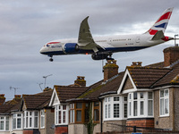 British Airways Boeing 787-8 Dreamliner aircraft spotted flying on final approach over the roofs of the houses of Myrtle avenue for landing...