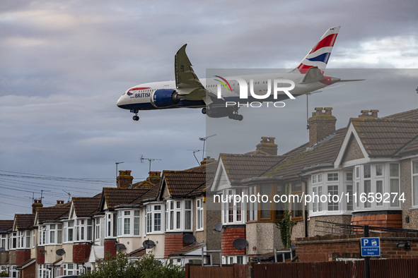 British Airways Boeing 787-8 Dreamliner aircraft spotted flying on final approach over the roofs of the houses of Myrtle avenue for landing...