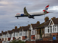 British Airways Boeing 787-8 Dreamliner aircraft spotted flying on final approach over the roofs of the houses of Myrtle avenue for landing...