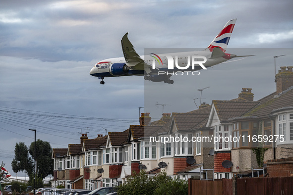 British Airways Boeing 787-8 Dreamliner aircraft spotted flying on final approach over the roofs of the houses of Myrtle avenue for landing...