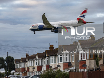 British Airways Boeing 787-8 Dreamliner aircraft spotted flying on final approach over the roofs of the houses of Myrtle avenue for landing...