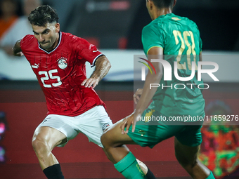 Ahmed Mostafa of Egypt battles for possession with Oumar Jacky Ngom of Mauritania during Africa Cup of Nations qualifiers 2025 match number...