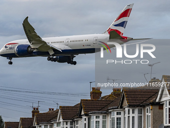 British Airways Boeing 787-8 Dreamliner aircraft spotted flying on final approach over the roofs of the houses of Myrtle avenue for landing...