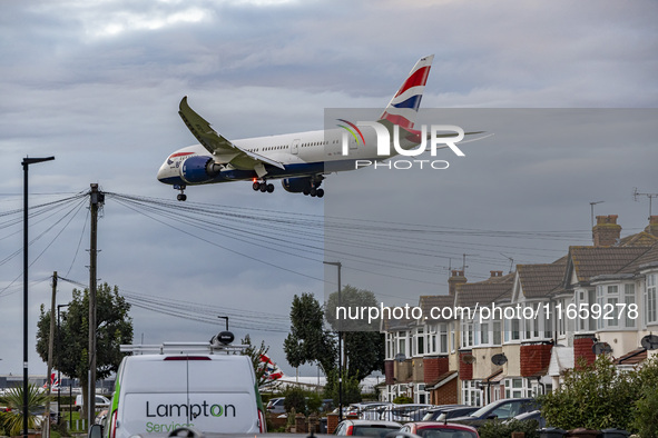 British Airways Boeing 787-8 Dreamliner aircraft spotted flying on final approach over the roofs of the houses of Myrtle avenue for landing...